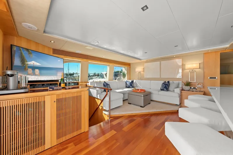 Tranquility Yacht Photos Pics Luxurious 2013 Horizon PC60 yacht interior with elegant seating, wooden flooring, and large windows.