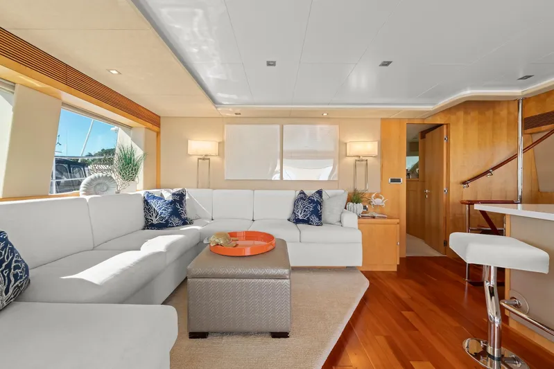 Tranquility Yacht Photos Pics Luxurious interior of 2013 Horizon PC60 yacht with elegant white seating and wooden accents.