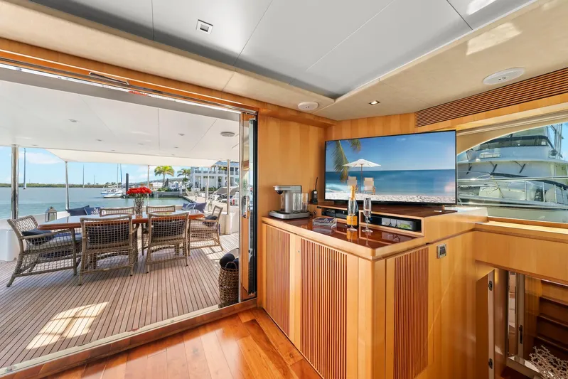 Tranquility Yacht Photos Pics Luxurious Horizon PC60 yacht interior with outdoor dining area, ocean view, and modern amenities, 2013 model.