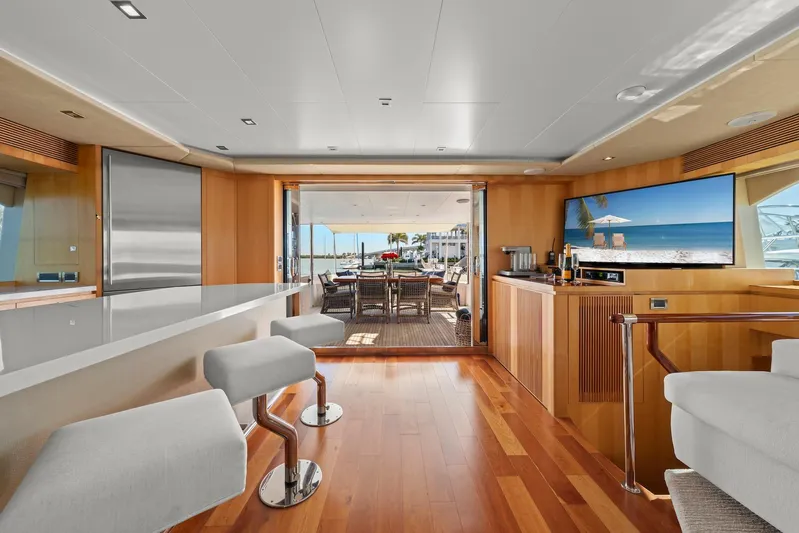 Tranquility Yacht Photos Pics Luxurious Horizon PC60 yacht interior with modern bar, seating, and ocean view.