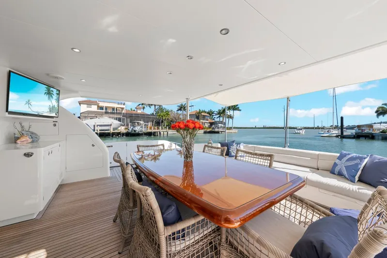 Tranquility Yacht Photos Pics Luxurious Horizon PC60 yacht deck with elegant dining area, waterfront view, and modern amenities, 2013 model.