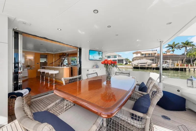 Tranquility Yacht Photos Pics Luxurious 2013 Horizon PC60 yacht interior with elegant dining area and waterfront view.