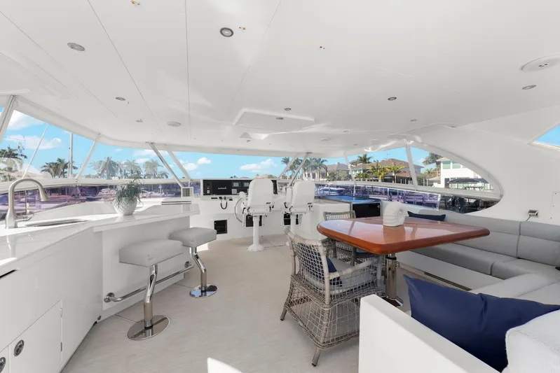 Tranquility Yacht Photos Pics Luxurious 2013 Horizon PC60 yacht interior with modern seating, dining area, and panoramic windows.