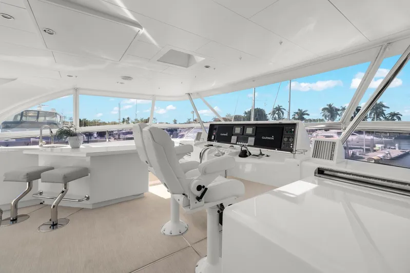 Tranquility Yacht Photos Pics Luxurious 2013 Horizon PC60 yacht interior with modern helm and panoramic windows.