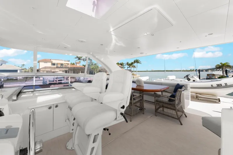 Tranquility Yacht Photos Pics Luxurious 2013 Horizon PC60 yacht interior with white seating and waterfront view.
