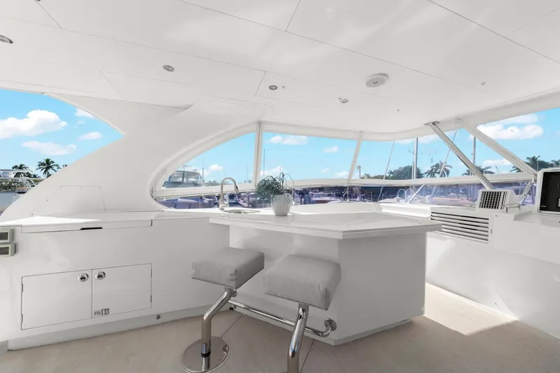 Tranquility Yacht Photos Pics Luxurious 2013 Horizon PC60 yacht interior with modern seating and panoramic windows.