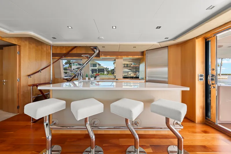 Tranquility Yacht Photos Pics Luxurious yacht interior with modern bar and stools, Horizon PC60, 2013 model.