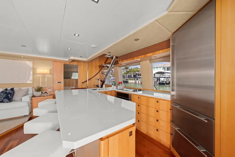 Tranquility Yacht Photos Pics Luxurious yacht interior with modern kitchen, sleek countertops, and waterfront view. Horizon PC60, 2013 model.