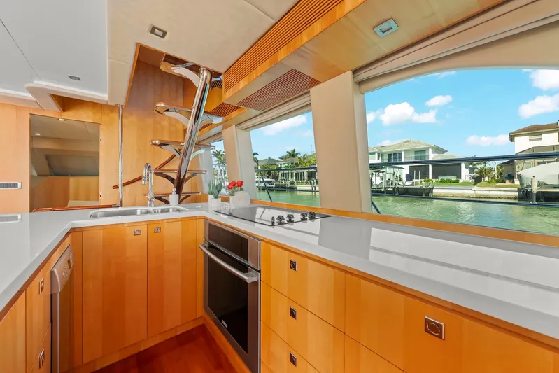 Tranquility Yacht Photos Pics Luxurious yacht kitchen interior with modern appliances and waterfront view, Horizon PC60 2013 model.