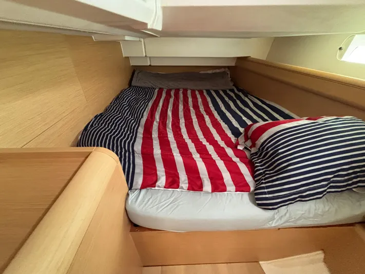 Khushali Yacht Photos Pics Cozy cabin bed with striped bedding in 2019 Jeanneau Sun Odyssey 419 sailboat.