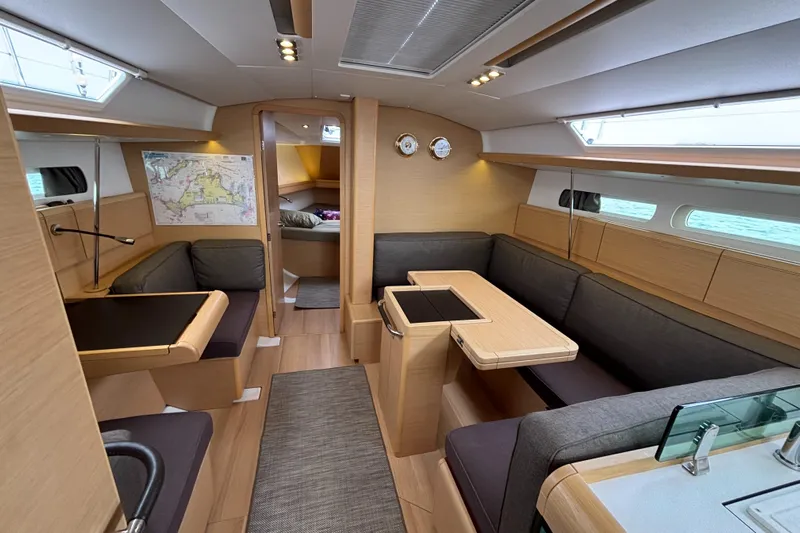 Khushali Yacht Photos Pics Interior of 2019 Jeanneau Sun Odyssey 419 sailboat, featuring modern seating and navigation area.