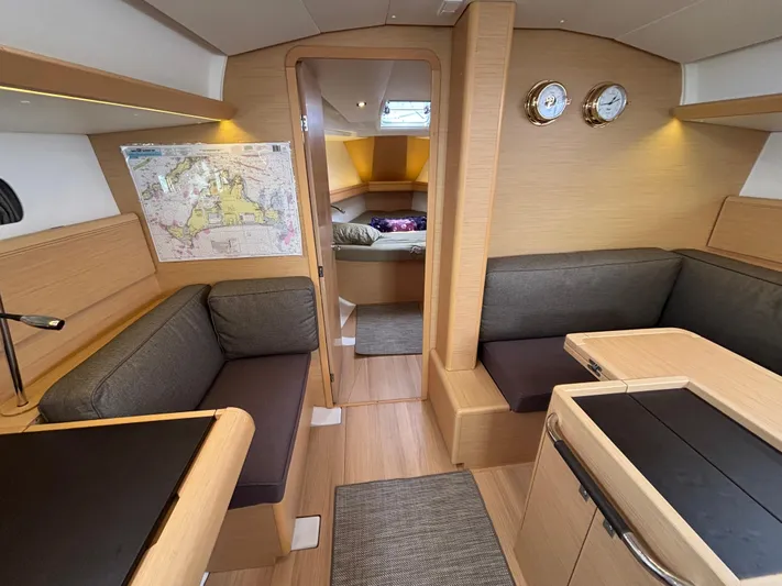 Khushali Yacht Photos Pics Interior of 2019 Jeanneau Sun Odyssey 419 sailboat, featuring cozy seating and nautical decor.