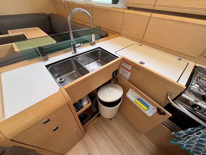 Khushali Yacht Photos Pics Modern kitchen in 2019 Jeanneau Sun Odyssey 419 yacht with dual sinks and ample storage.