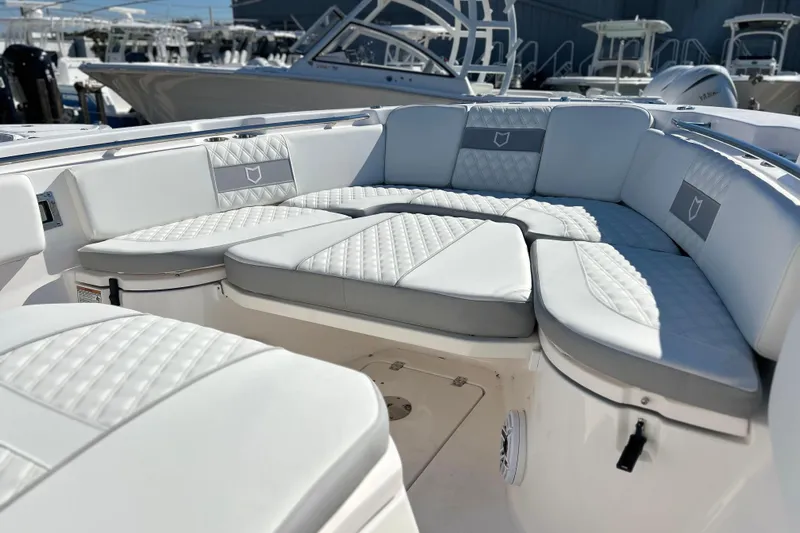  Yacht Photos Pics Luxurious seating on 2026 Sea Fox 288 Commander boat, featuring elegant white upholstery.