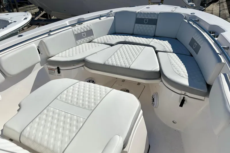  Yacht Photos Pics Luxurious seating on 2026 Sea Fox 288 Commander boat, featuring elegant white upholstery.