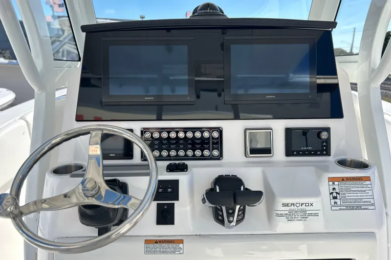  Yacht Photos Pics 2026 Sea Fox 288 Commander dashboard with dual Garmin displays and steering wheel.