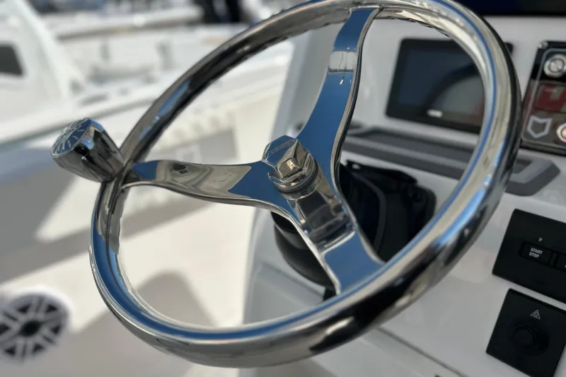  Yacht Photos Pics Steering wheel of 2026 Sea Fox 288 Commander boat, featuring modern controls and sleek design.