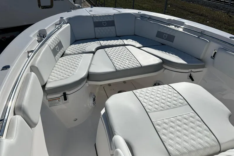  Yacht Photos Pics 2026 Sea Fox 288 Commander boat with luxurious white seating and quilted upholstery.