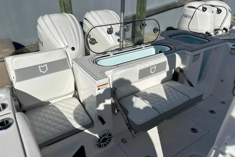  Yacht Photos Pics 2026 Sea Fox 288 Commander boat interior with cushioned seating and Yamaha engines.