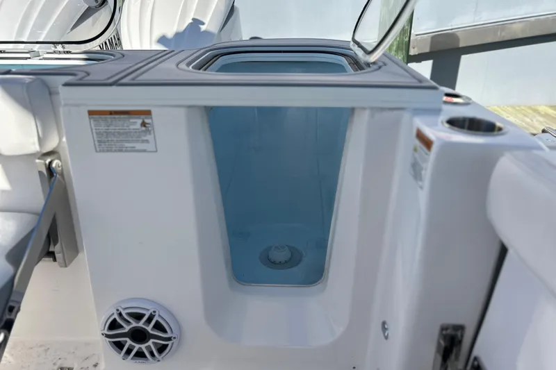  Yacht Photos Pics 2026 Sea Fox 288 Commander boat storage compartment with open lid and visible speaker.