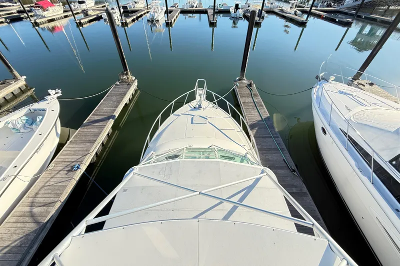 Sea Dated Yacht Photos Pics Overhead view of a 1996 Cabo 35 boat docked at a marina.