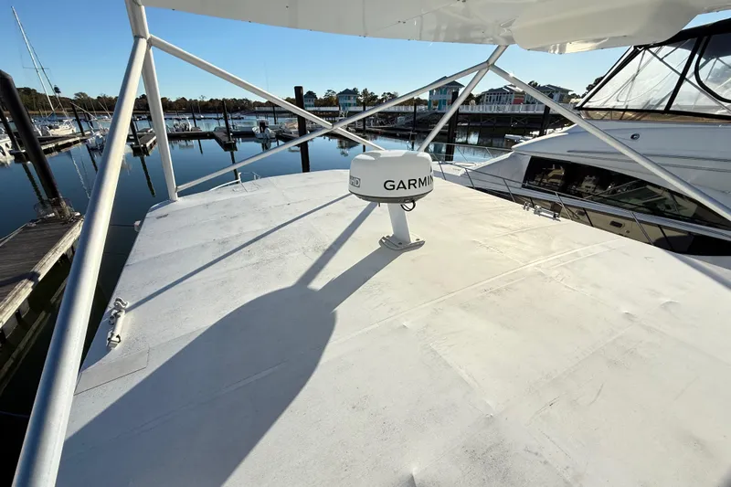Sea Dated Yacht Photos Pics Rooftop view of 1996 Cabo 35 boat with Garmin radar at marina.