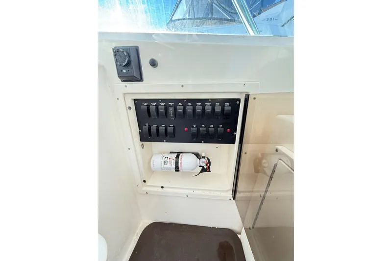 Sea Dated Yacht Photos Pics Control panel and fire extinguisher on 1996 Cabo 35 boat.