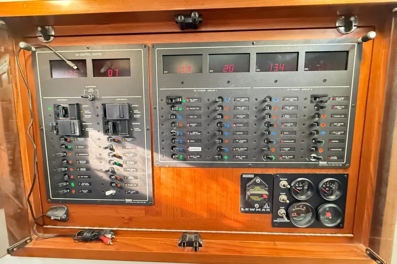 Sea Dated Yacht Photos Pics Electrical control panel of a 1996 Cabo 35 boat, featuring various switches and gauges.