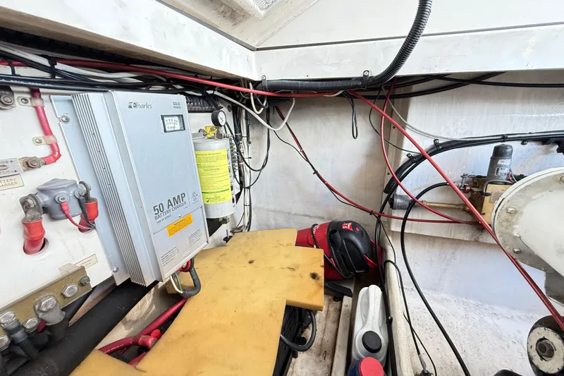 Sea Dated Yacht Photos Pics Electrical system inside a 1996 Cabo 35 boat, featuring a 50 AMP battery charger.