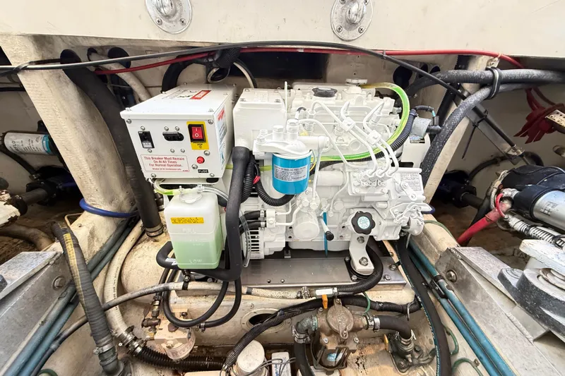 Sea Dated Yacht Photos Pics Engine compartment of a 1996 Cabo 35 boat, showcasing mechanical components and wiring.