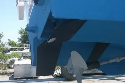 Sea Dated Yacht Photos Pics 1996 Cabo 35 boat stern with propeller and rudder, docked outdoors.