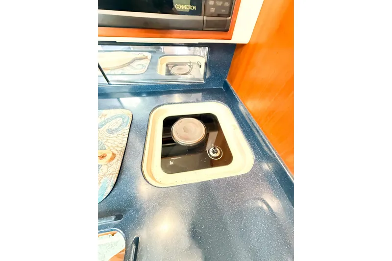 Sea Dated Yacht Photos Pics Kitchen area on a 1996 Cabo 35 boat.