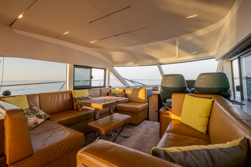 Valluga Yacht Photos Pics Luxurious interior of 2018 Bavaria R55 yacht with leather seating and ocean view.