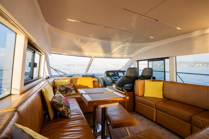 Valluga Yacht Photos Pics Luxurious interior of 2018 Bavaria R55 yacht with leather seating and panoramic windows.