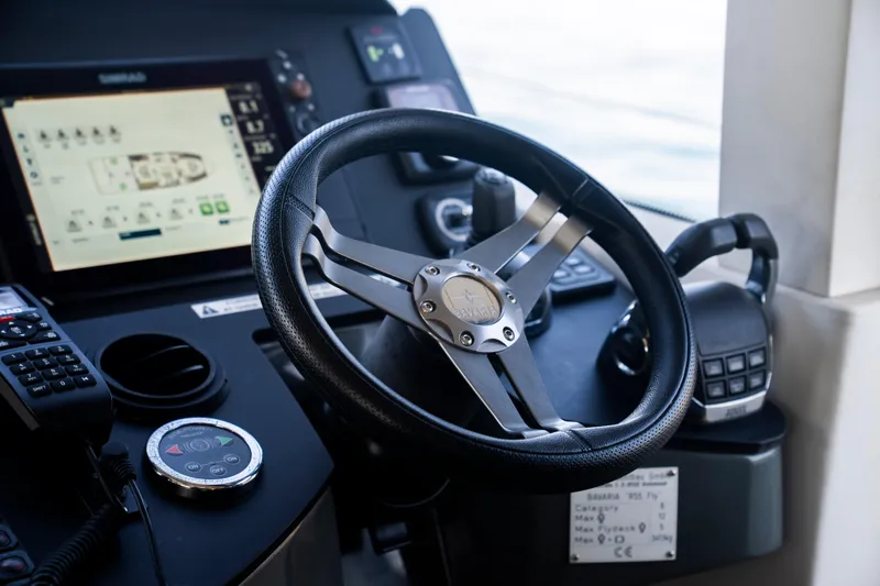 Valluga Yacht Photos Pics Steering wheel and controls of a 2018 Bavaria R55 yacht cockpit.