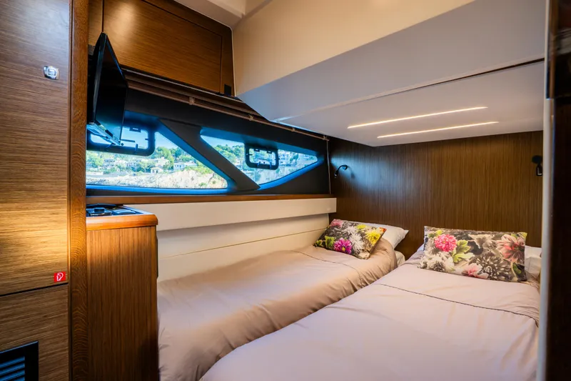 Valluga Yacht Photos Pics Luxurious 2018 Bavaria R55 yacht cabin with twin beds and scenic window view.