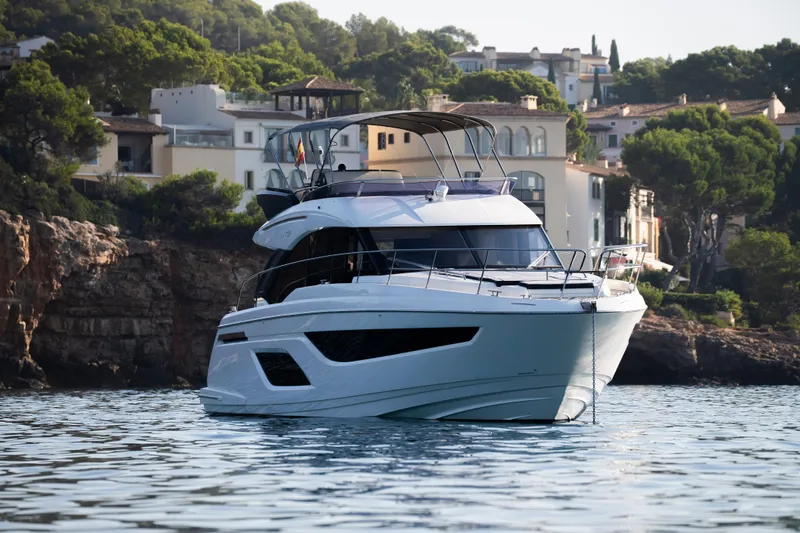 Valluga Yacht Photos Pics Luxury Bavaria R55 yacht from 2018 on serene coastal waters.