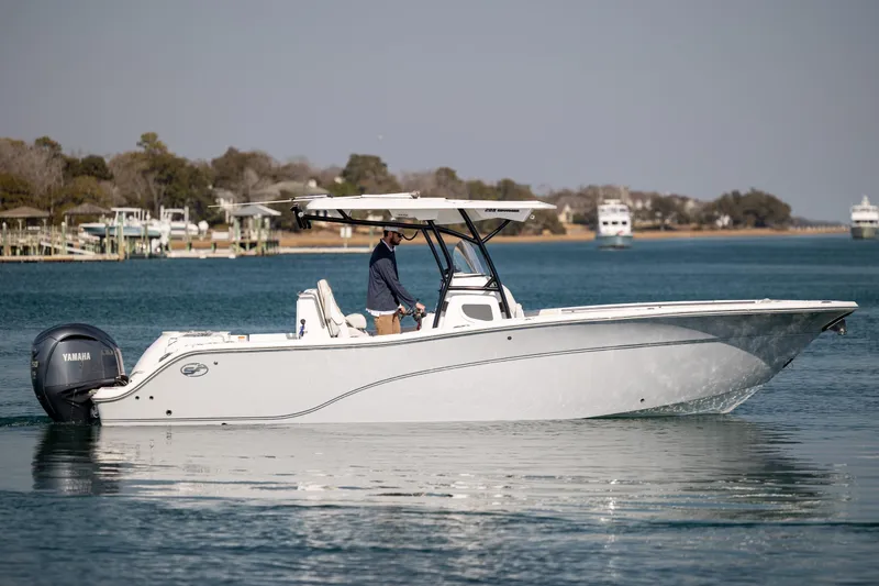  Yacht Photos Pics 2023 Sea Fox 288 Commander boat cruising on calm waters with scenic background.