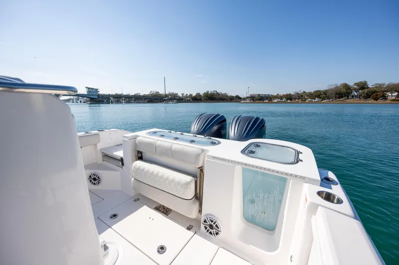  Yacht Photos Pics 2023 Sea Fox 288 Commander boat on calm water, featuring dual engines and spacious deck.
