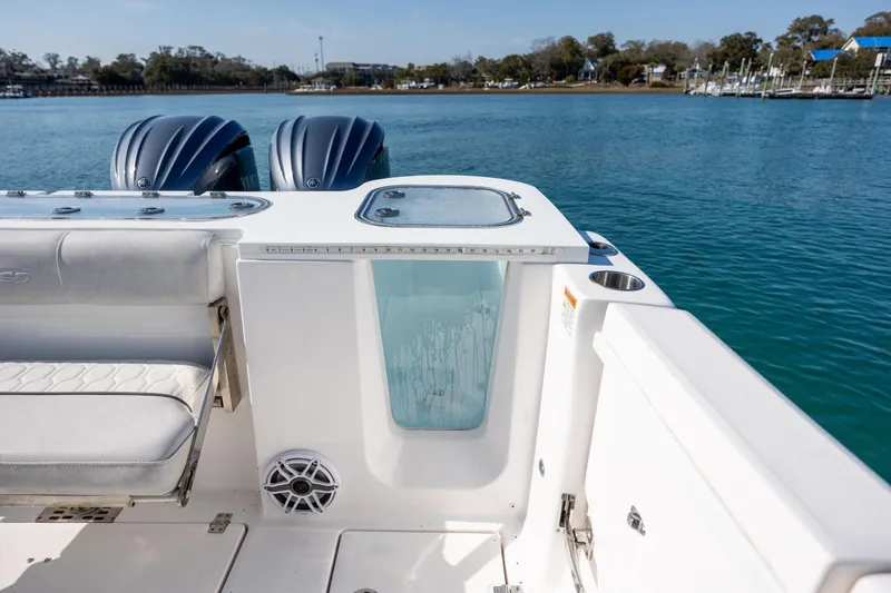  Yacht Photos Pics 2023 Sea Fox 288 Commander boat with dual engines on a serene waterway.