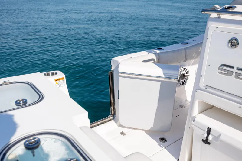  Yacht Photos Pics 2023 Sea Fox 288 Commander boat deck with open door, overlooking blue ocean.