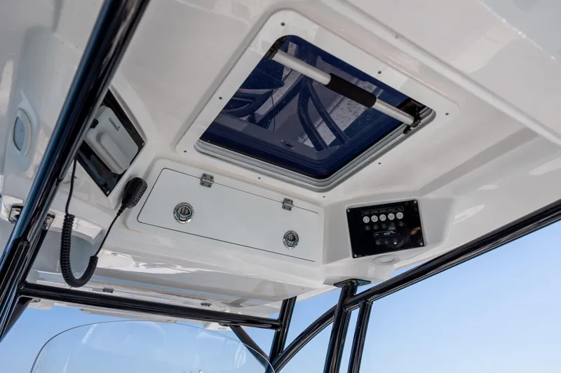  Yacht Photos Pics 2023 Sea Fox 288 Commander boat interior with control panel and hatch.