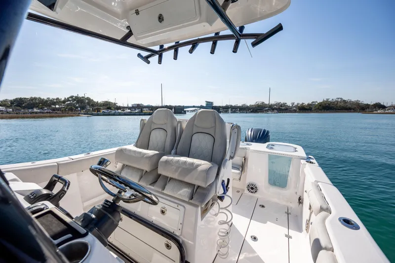  Yacht Photos Pics 2023 Sea Fox 288 Commander boat interior with dual seats on a sunny day.