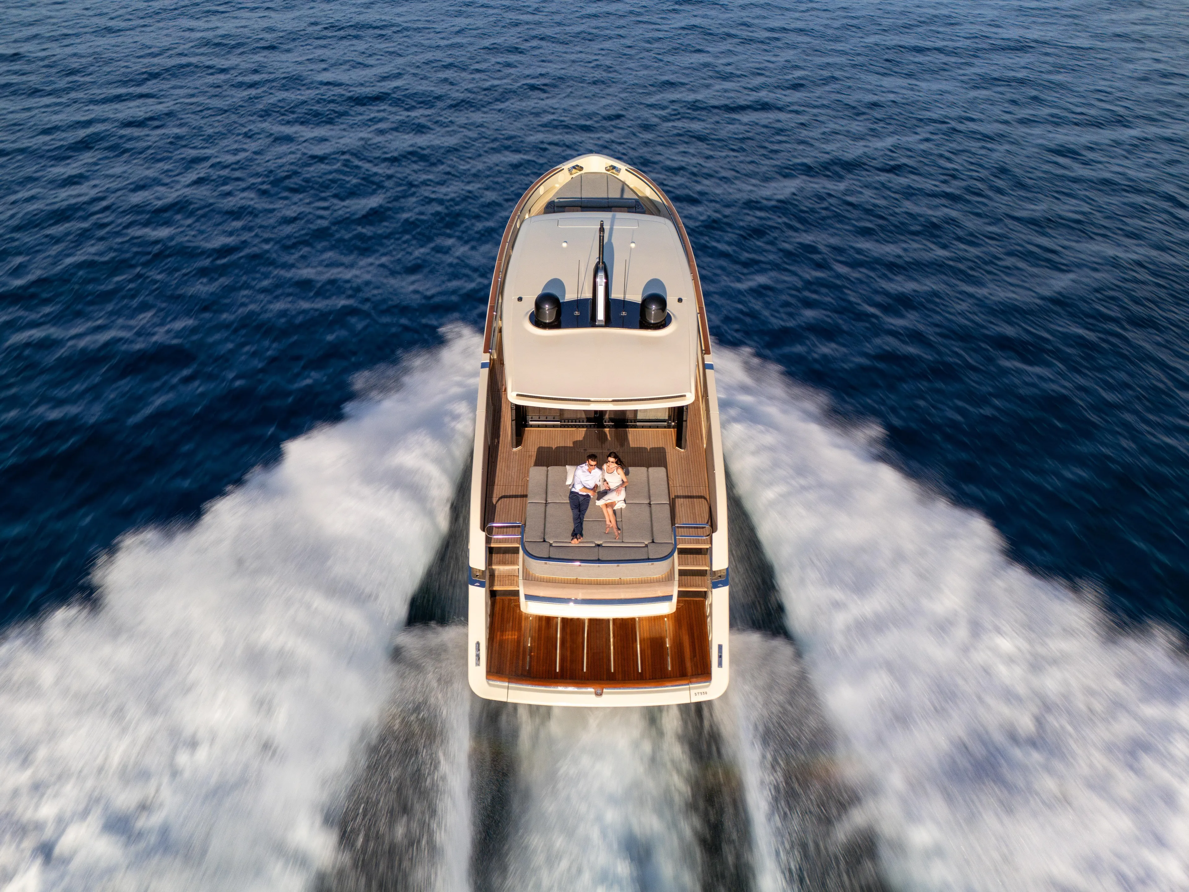  Yacht Photos Pics Aerial view of 2025 Invictus ST550 yacht cruising on open water.