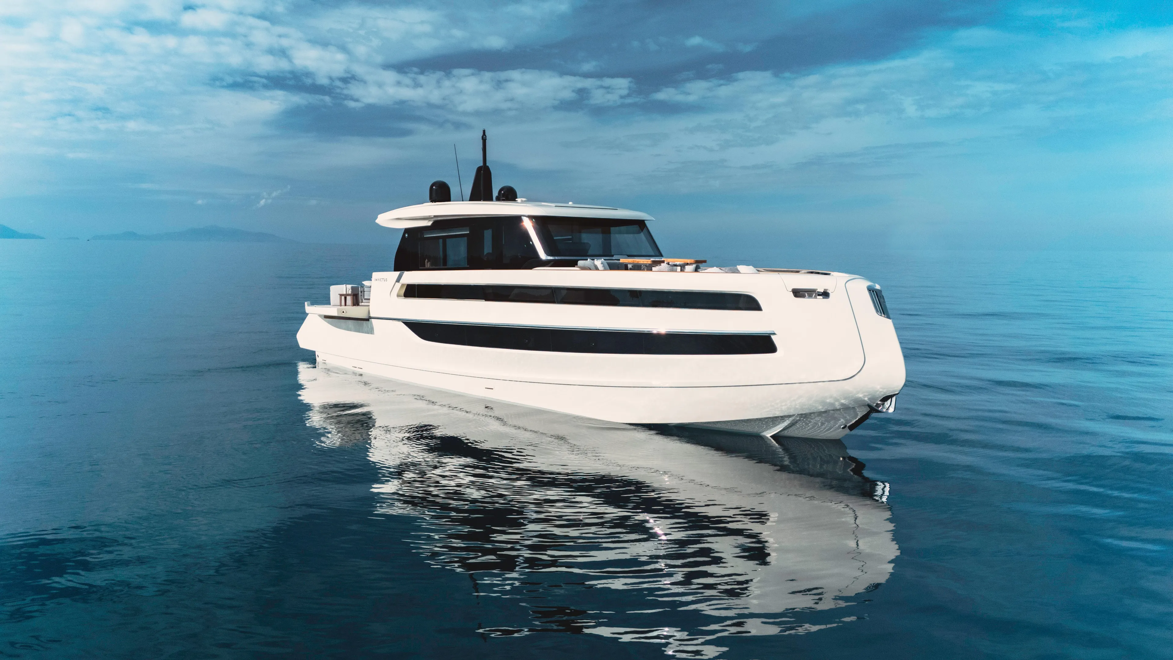  Yacht Photos Pics Invictus ST550 yacht, 2025 model, cruising on calm blue waters under a clear sky.
