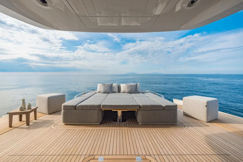  Yacht Photos Pics Luxurious Invictus ST550 yacht deck with elegant seating, ocean view, 2025 model.