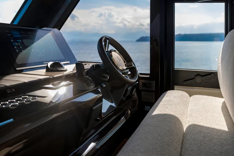  Yacht Photos Pics Interior of 2025 Invictus ST550 yacht with ocean view through window.