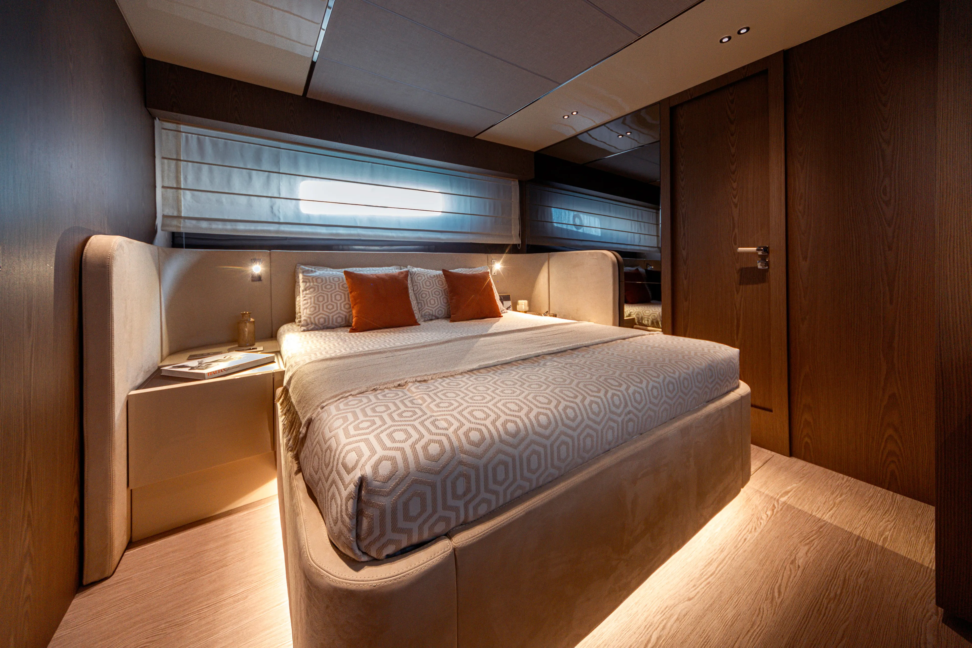  Yacht Photos Pics Luxurious bedroom interior of 2025 Invictus ST550 yacht with modern design and ambient lighting.