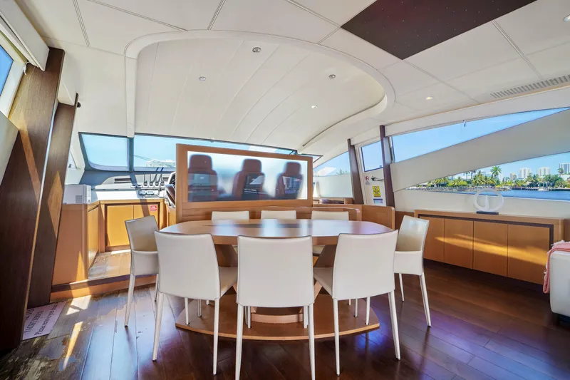Shadow Yacht Photos Pics Luxurious interior of a 2007 Pershing 90 yacht with modern dining area.