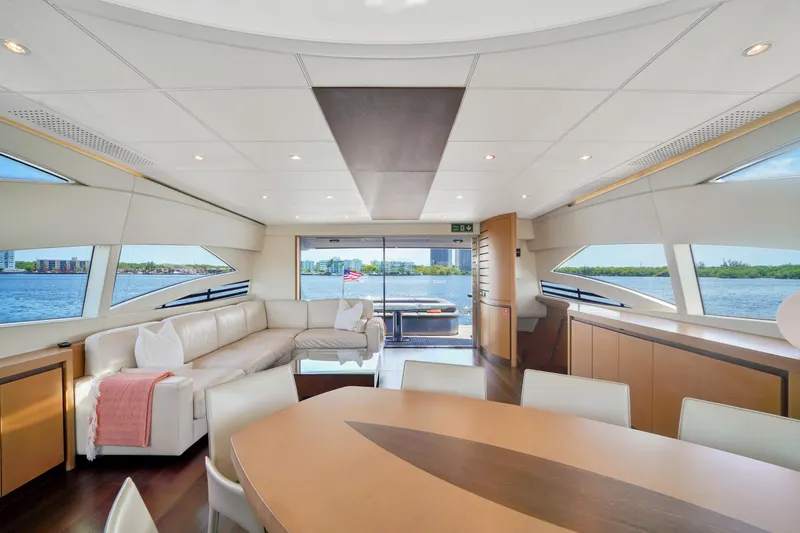 Shadow Yacht Photos Pics Luxurious interior of a 2007 Pershing 90 yacht with panoramic windows and modern furnishings.